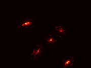 A Newly Discovered ‘Einstein’s Cross’ Reveals the Existence of a Giant Dark Matter Halo